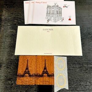 4 Hermes postcards, La duree stationary, 2 two Eiffel tower cards.